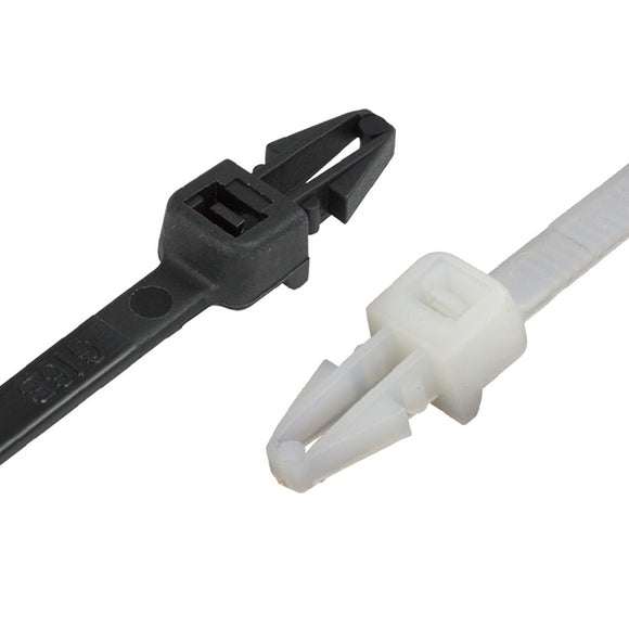 Push mounted cable ties securing cables in industrial panel with push-mount anchor