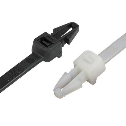Push mounted cable ties securing cables in industrial panel with push-mount anchor